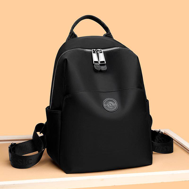 牛津布双肩包女2026新款时尚尼龙防水旅行通勤小背包简约帆布书包