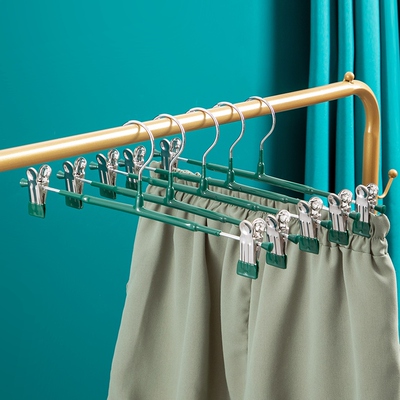 The rackers hang their skirts in their closets with their st