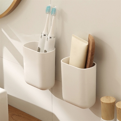 Wallbrush-top bathroom toothbrush racks on the washstands to