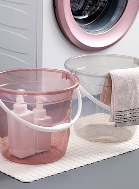 The house with the transparent buckets washes their clothes