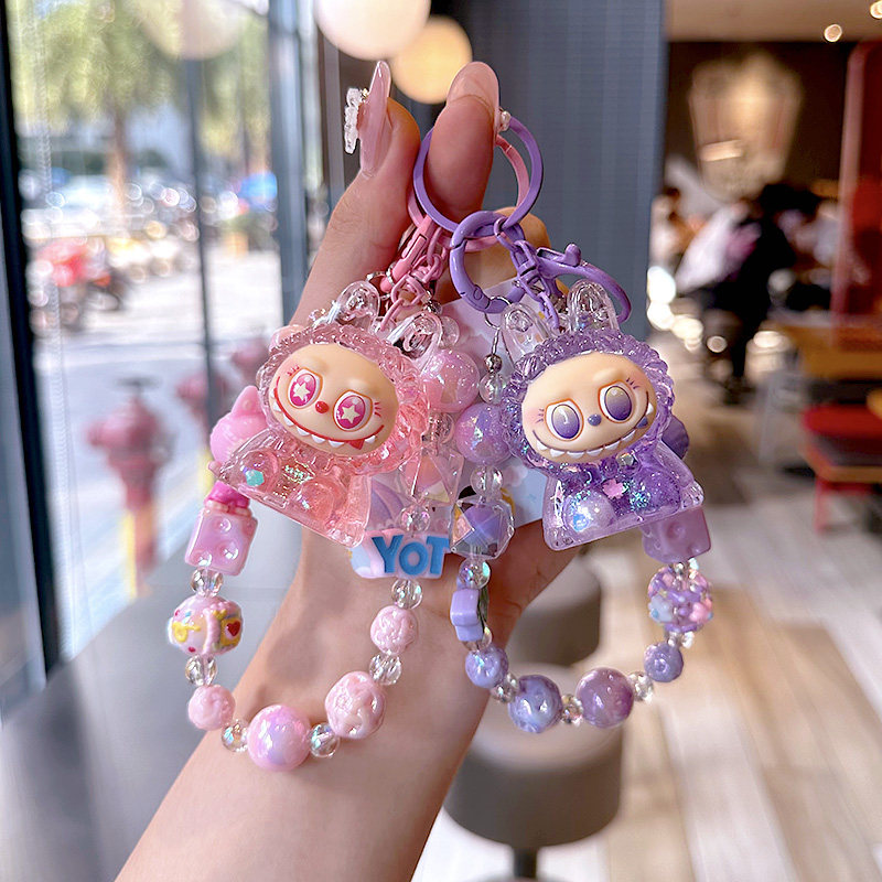 爆款创意流沙坐姿LL手机链挂件可爱情侣精致娃娃入油串珠书包挂饰