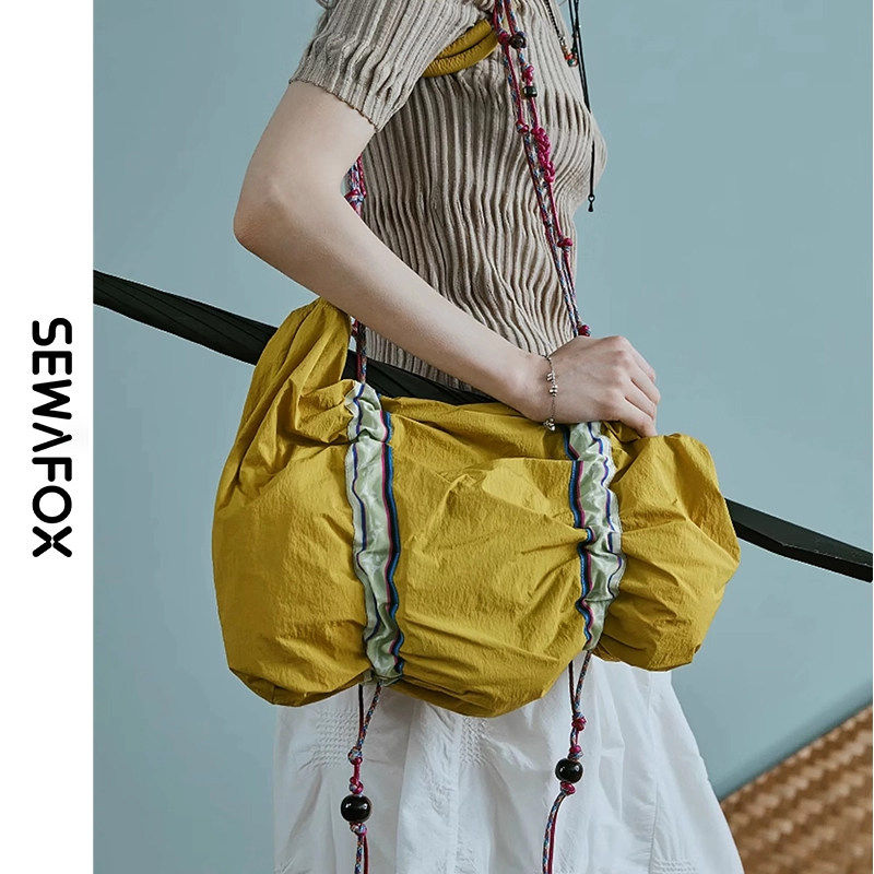 民族风单肩包斜挎包2026新款户外轻量化抽绳女款休闲旅行包女包包