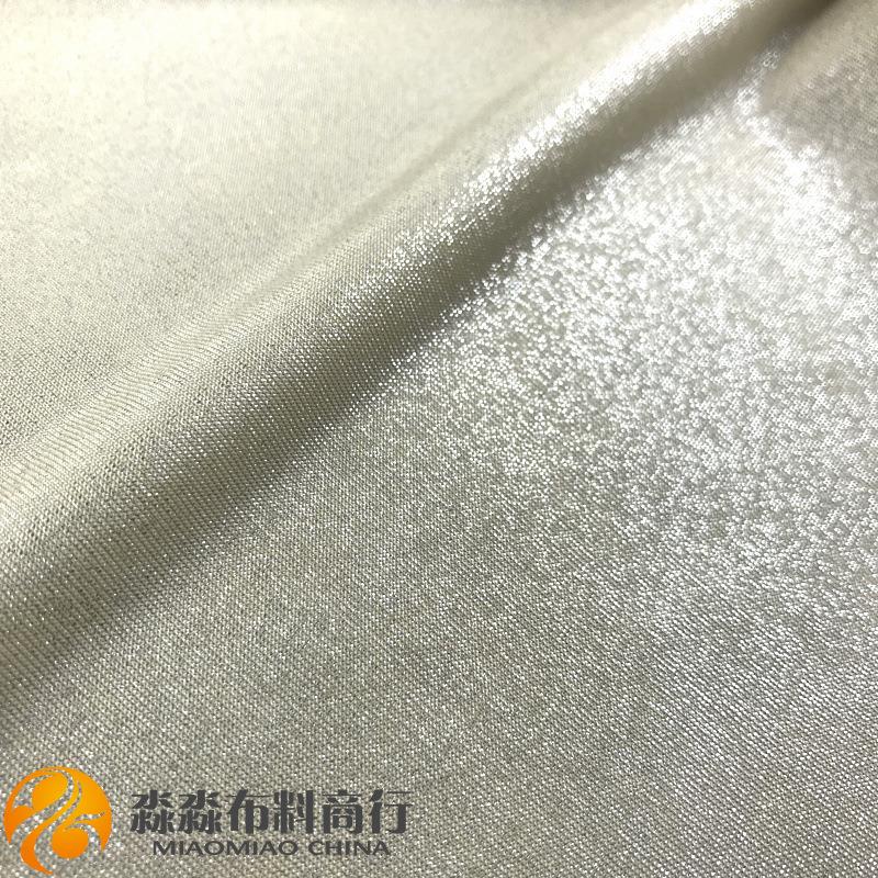 新春夏弹力布料电光彩色闪点烫金柔软金属色面料晚装包臀裙面料图片