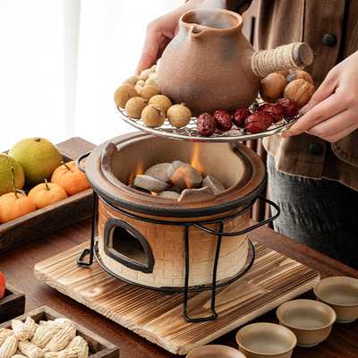 Surrounded by a stove, boiling tea and teapot, baking stove, pot, teapot, charcoal stove, utensil set, baking milk can,