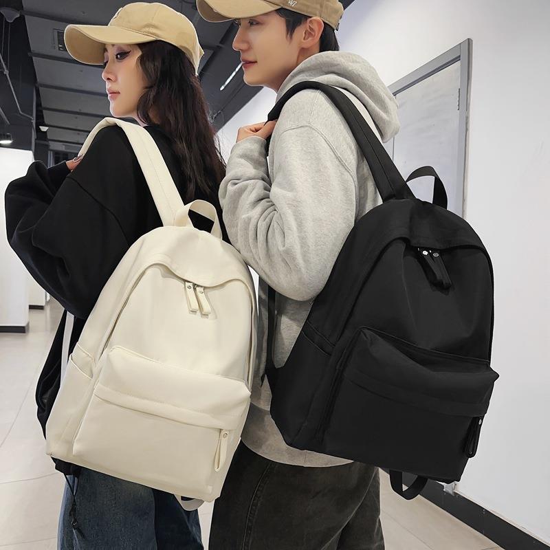 潮牌纯色学生书包大容量学院风双肩包大学生男女旅行背包休闲背包