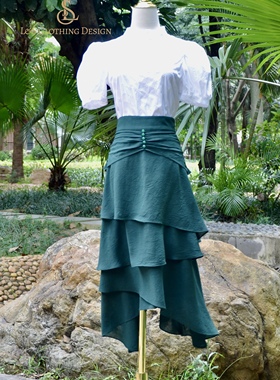 秋季新款轻奢小众设计超显白显气质墨绿色不规则半身中长半身裙