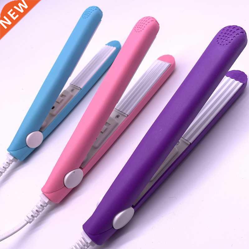 A mini hair iron pink corrugated plate electric curling iron