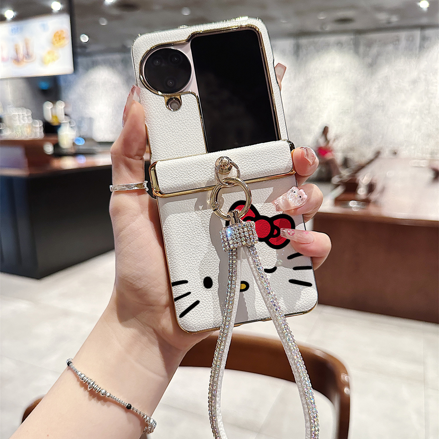 蝴蝶结KT猫荔枝纹折叠屏手机壳