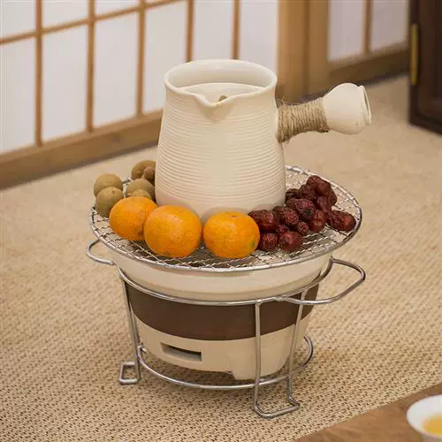 Керамическая плита для барбекю для кипячения чайной плиты Домашнее крылое угодье на открытом воздухе.