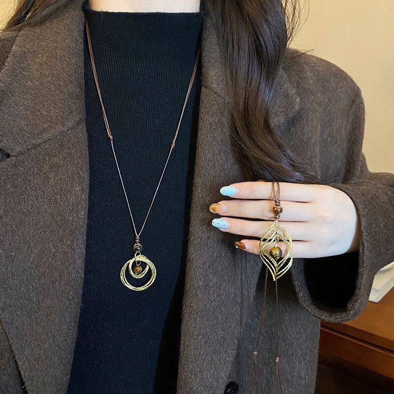 毛衣链轻奢女款长款美拉德项链金色装饰秋冬虎眼石吊坠配饰高级感