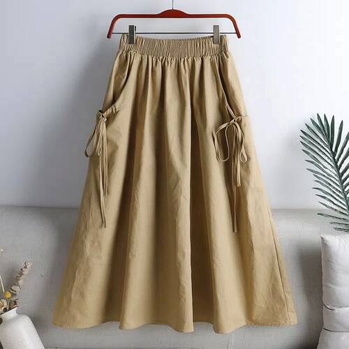 抽绳口袋中长款A字半身裙女