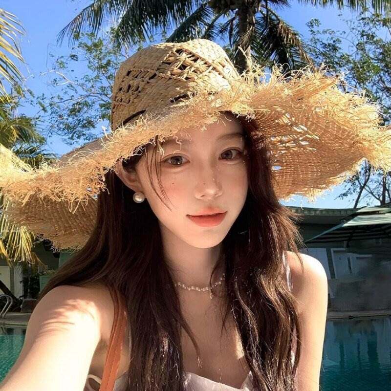 镂空拉菲草帽女2026新款海边沙滩三亚度假拍照大檐防晒遮太阳帽子