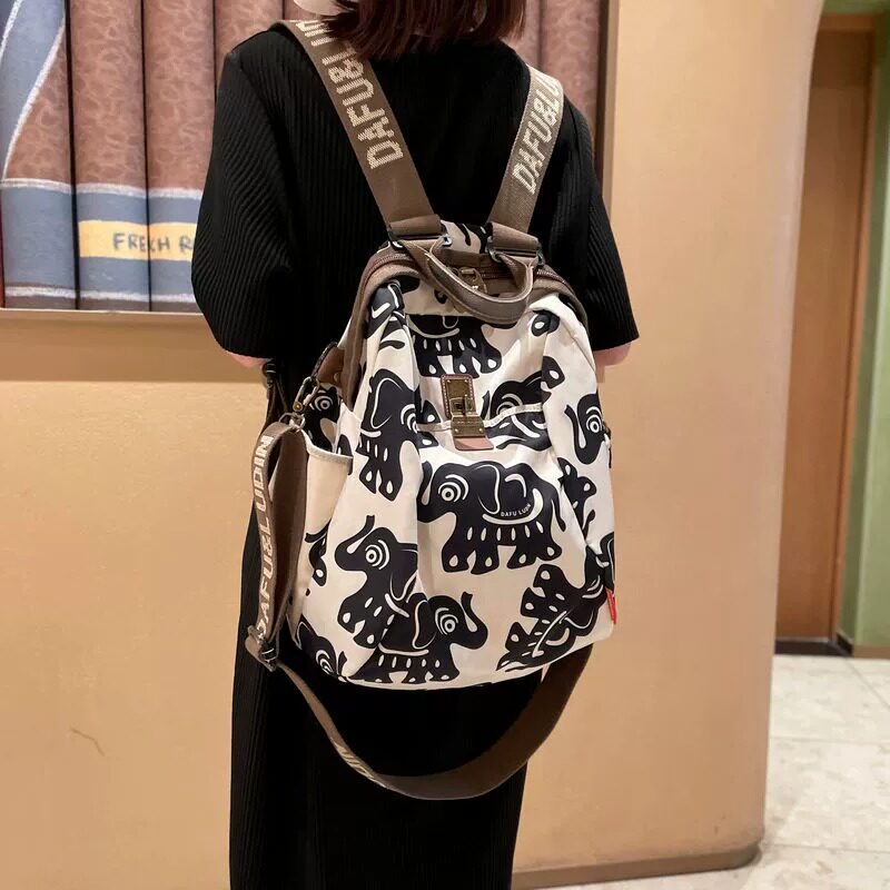 法国DUDK轻奢小吉象旅游双肩包女新款潮时尚旅行休闲户外笑脸背包