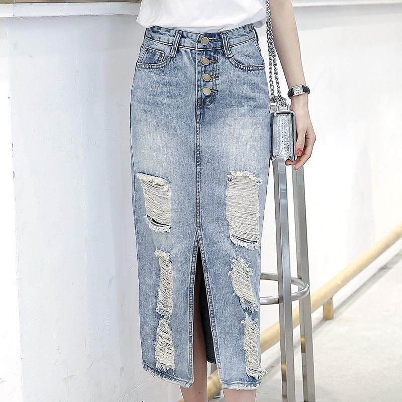 Denim skirt with long and torn holes, over the knee and butt