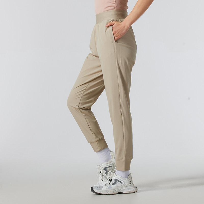 UA安德玛梭织长裤女裤春季美拉德风卡其色瑜伽跑步骑行运动裤