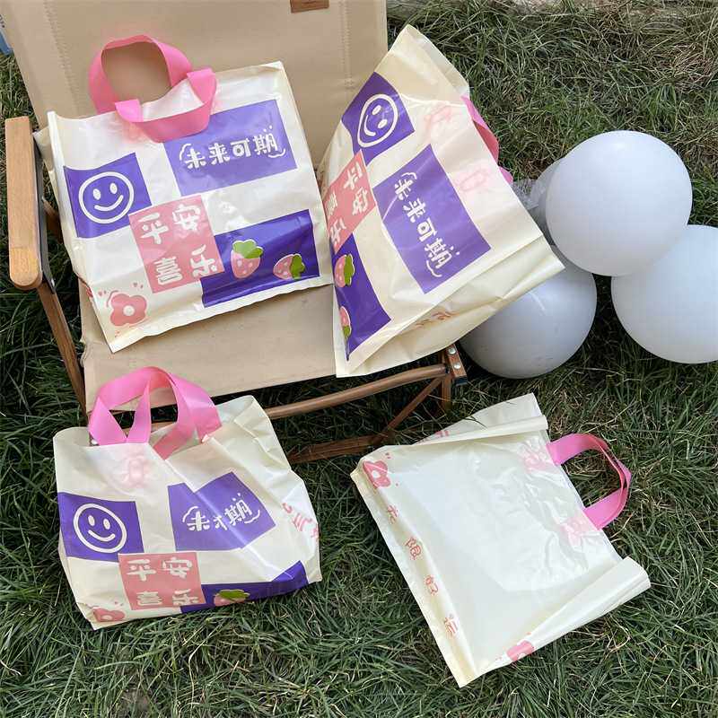 新款直销服装店用服饰塑料手提袋子喜庆礼品包装手拎带好看的时尚