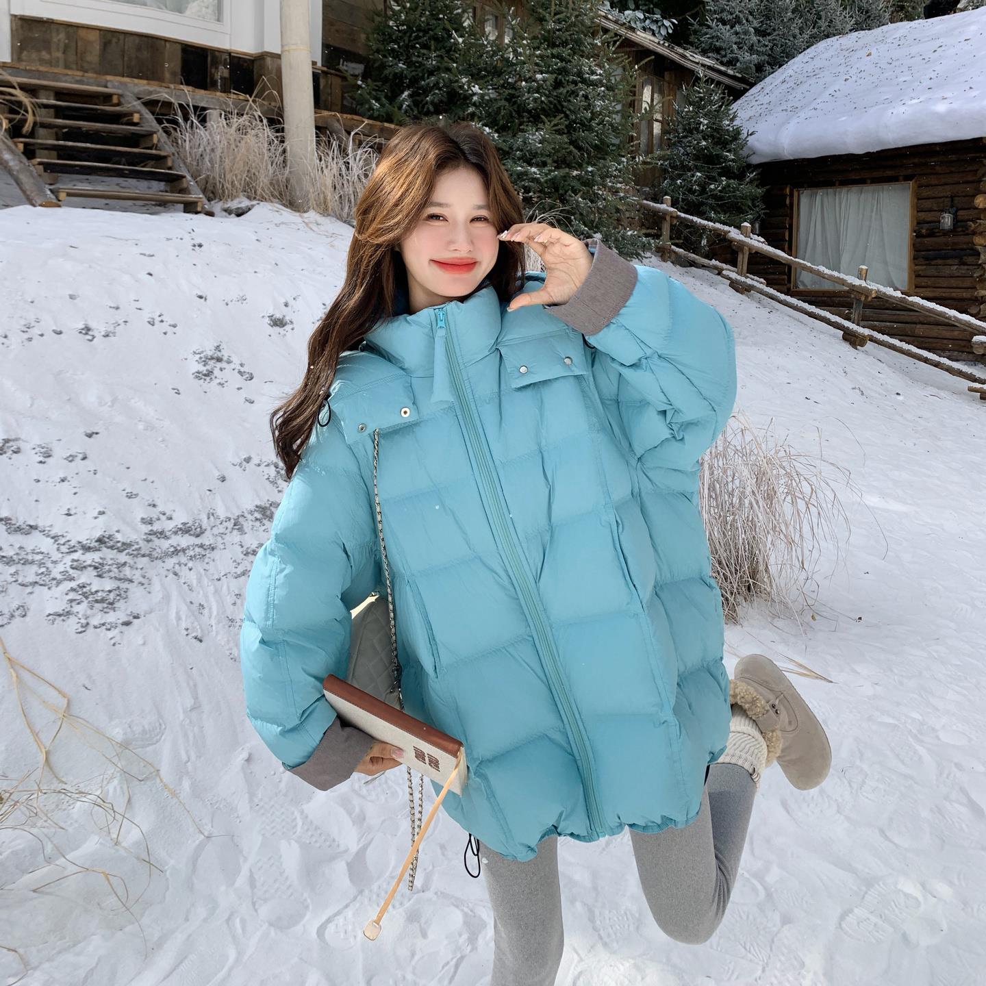 蓝色连帽中长款泡芙羽绒服女冬季2025年新款韩系宽松90白鸭绒外套