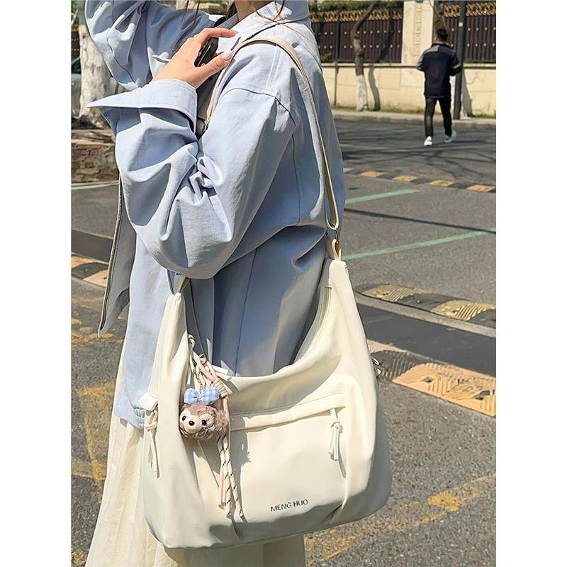 夏天帆布包包女式2026新款学生布包超火上班通勤单肩斜挎包饺子包