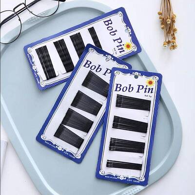 Black one-word hair clip with spray-painted edges, bangs hai