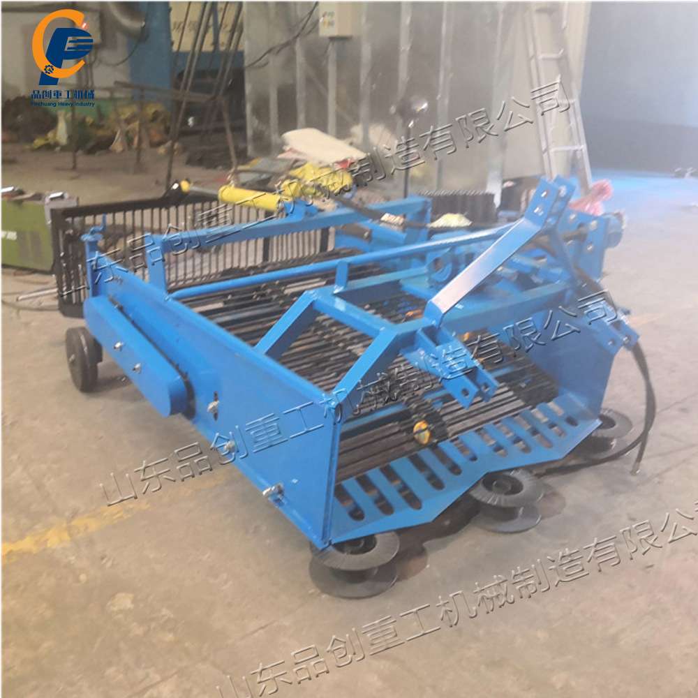 小型田间管理捡石机 牵引式农田石头清理机 液压筐碎石自动收集机