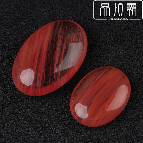 红色熔炼石手把件水晶把玩