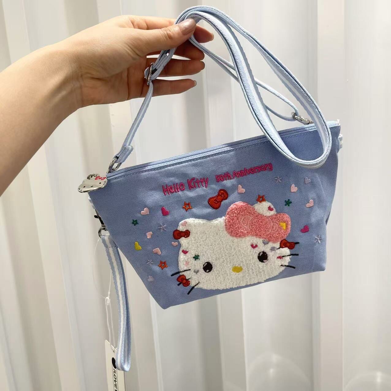 可爱卡通kt斜挎包立体刺绣手拎包女小巧手机包旅游轻便小包女水蓝