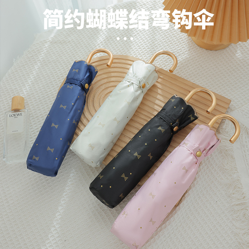 蝴蝶结刺绣弯钩三折伞UPF50+黑胶防紫外线太阳伞跨境晴雨两用伞