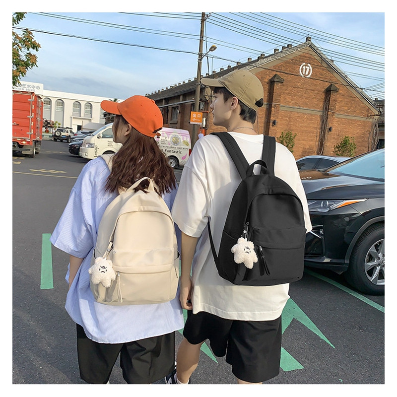 新款韩版初中生简约纯色书包休闲百搭女士双肩包时尚男生通勤包外