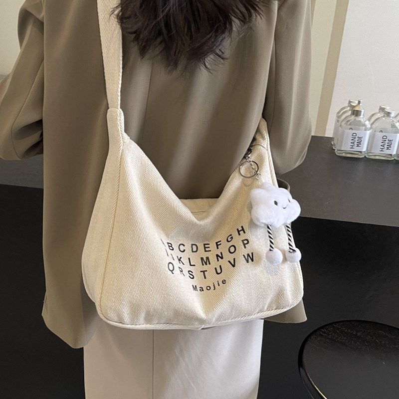简约大容量帆布包女2025新款夏季流行单肩包休闲通勤斜挎托特包
