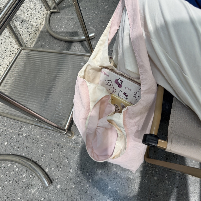 粉色包包帆布女款单肩手提腋下挎包通勤大容量杂物小拎包2025新款