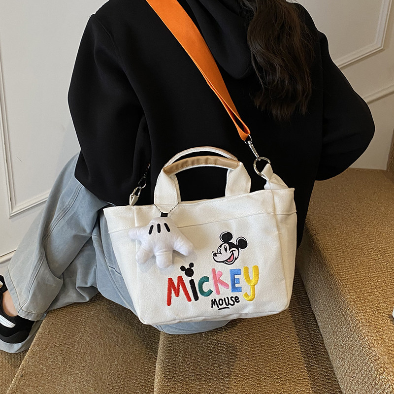 文艺时尚刺绣帆布包包2025韩版ins小众设计字母单肩包通勤水桶包