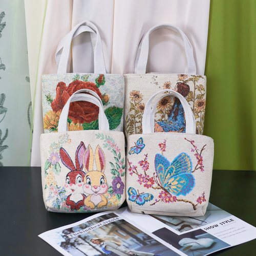 新款可爱双面刺绣帆布手提包拉链外出百搭上班小拎包便携手机包