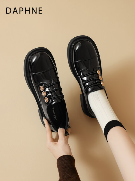 Black patent leather lace-up loafers with gold button details