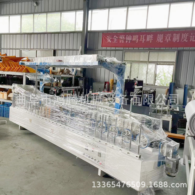 鸿腾效果好速度快集成墙板覆膜机300木塑格栅板包覆机冷胶包覆机