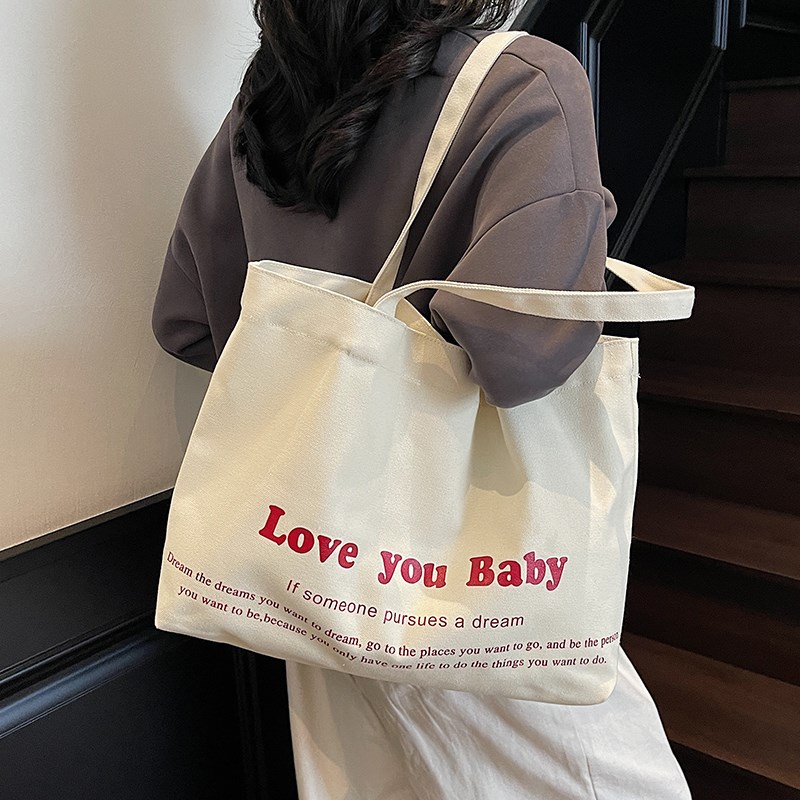 简约大容量帆布包女夏2025新款时尚字母印花手提袋百搭ins托特包