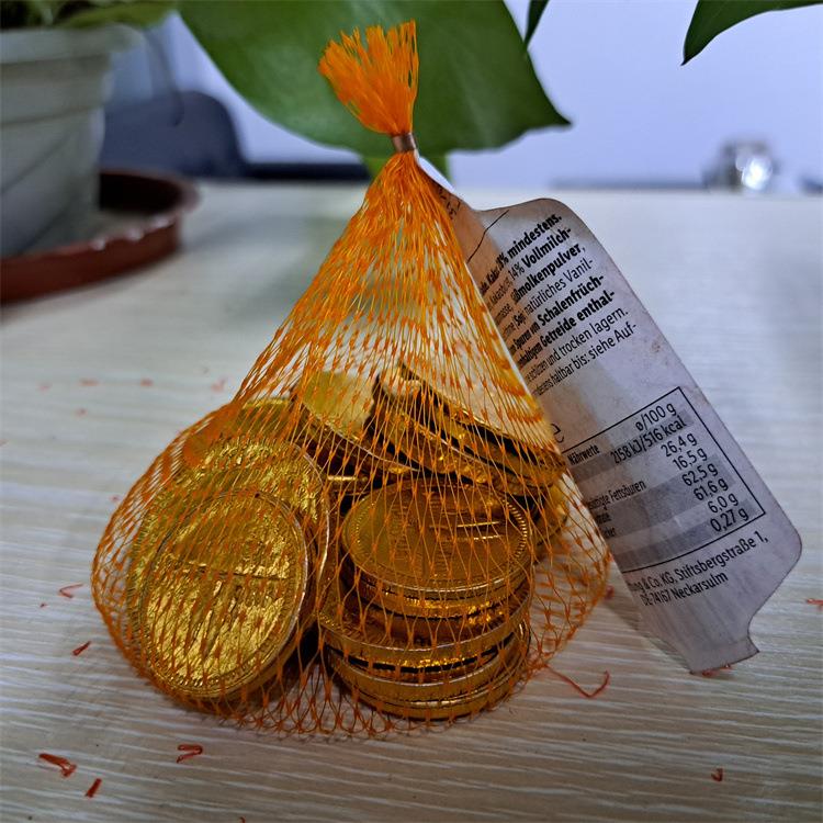 半自动网兜袋包装机市土豆CCD蒜头生姜包套袋机给打袋式超网扎口