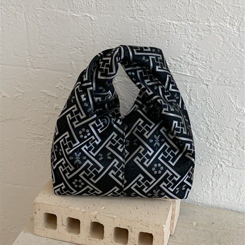 韩版简约通勤手拎饺子包包女2026春季新款高级质感轻奢小众手拿包