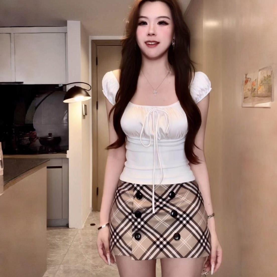 美式复古双排扣格纹半身裙女2026夏季新款低腰辣妹御姐包臀裙短裙