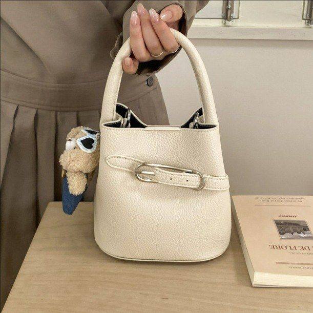 韩版高颜值手提水桶包包女包2026春季新款时髦单肩包复古斜挎包潮,箱包皮具/热销女包/男包,水桶包,淘宝优惠券,粉丝福利购,淘宝优惠卷