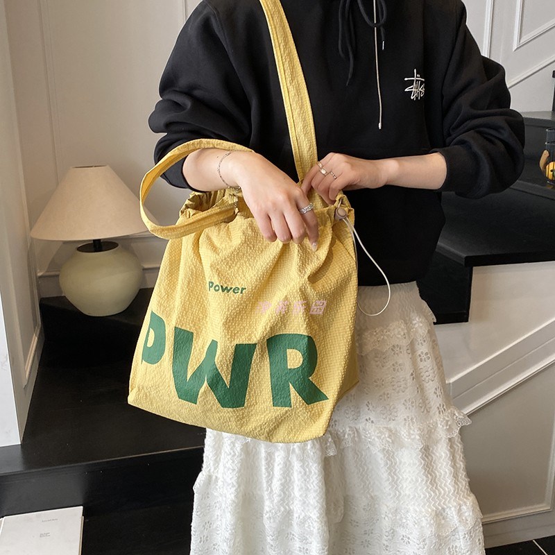 抽绳防水尼龙包日系托特包2025夏季新款通勤手提袋单肩包大容量包