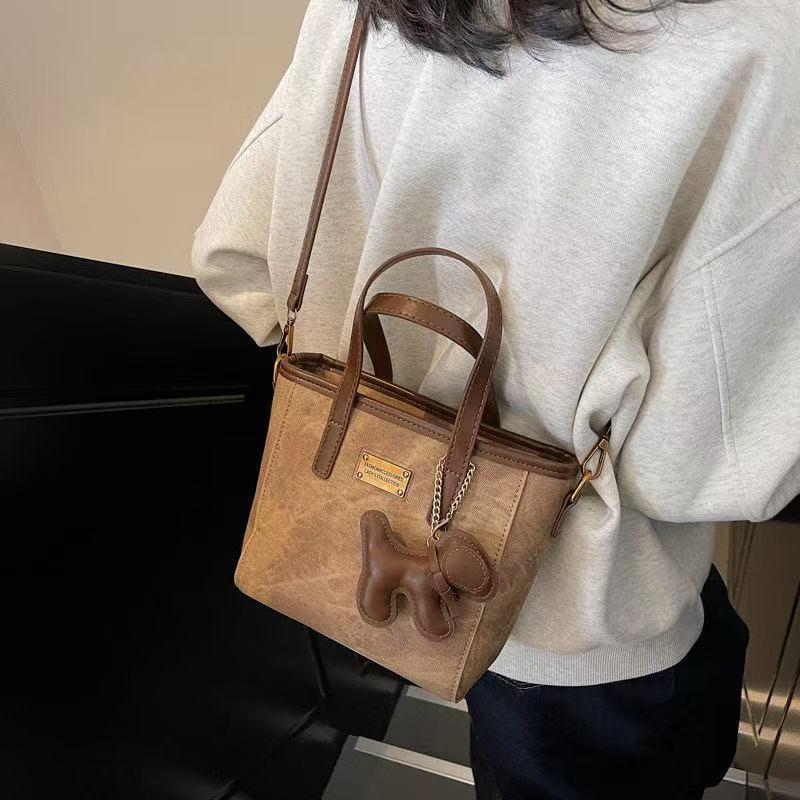 时尚百搭水桶包女2025春季新款休闲简约潮流斜挎包手提小包包C1