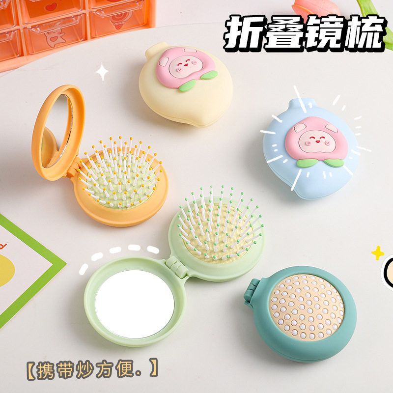 镜梳两用小圆镜尼龙齿气囊按摩梳ABS塑料外壳便携折叠化妆镜子