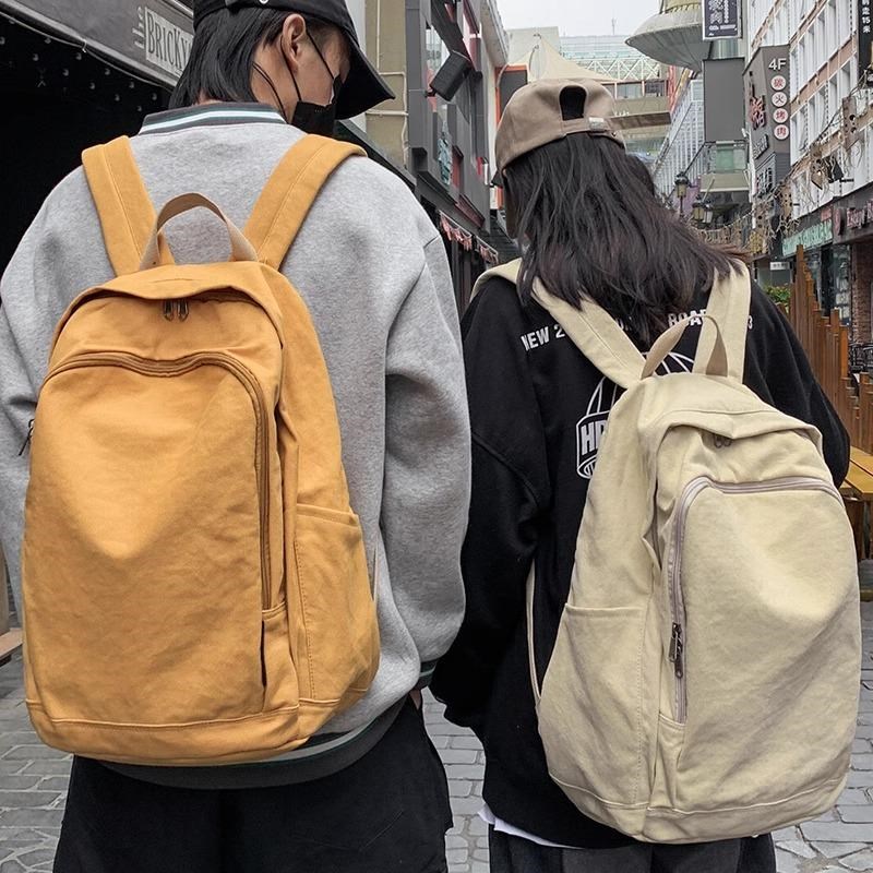 帆布女大学生书包k简约男初高中学生双肩包旅行大容量复古挂件背