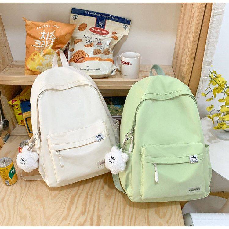 简约书包女新款大学生日系旅行双肩包韩版纯色初中小学生休闲背包