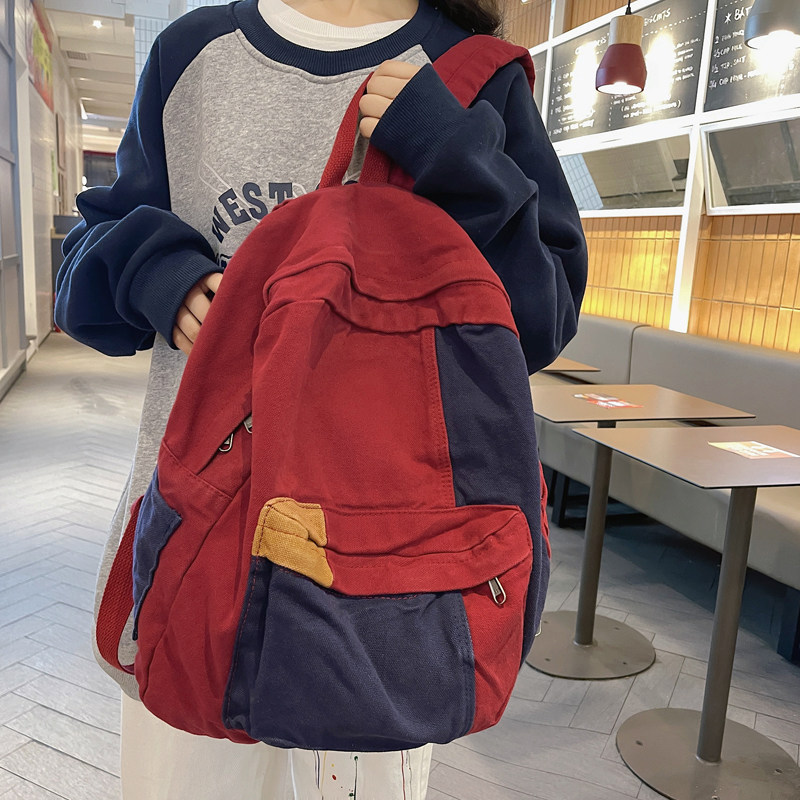 日系复古森系帆布双肩包女书包女ins撞色垂坠感小众休闲学生揹包
