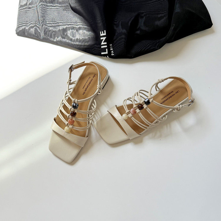 露趾凉鞋女款夏季平底配裙子上班不累脚时尚高级感镂空绑带罗马鞋