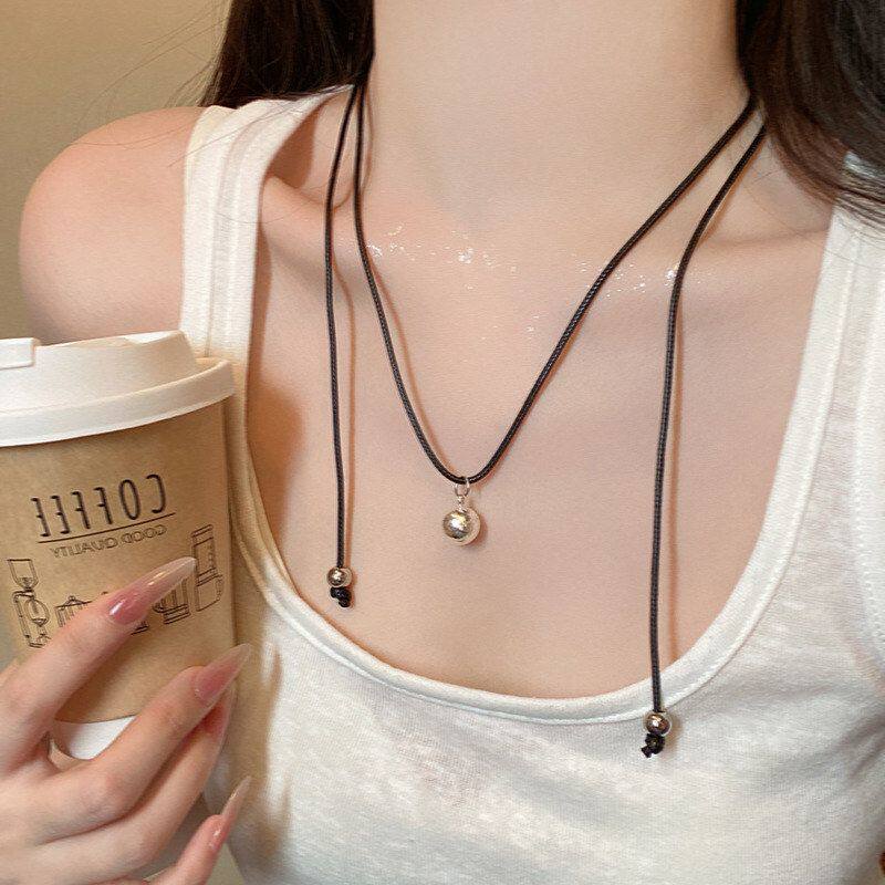 吊坠项链风高级感2025配饰金属长款极简女链轻奢新款圆形冷淡黑绳