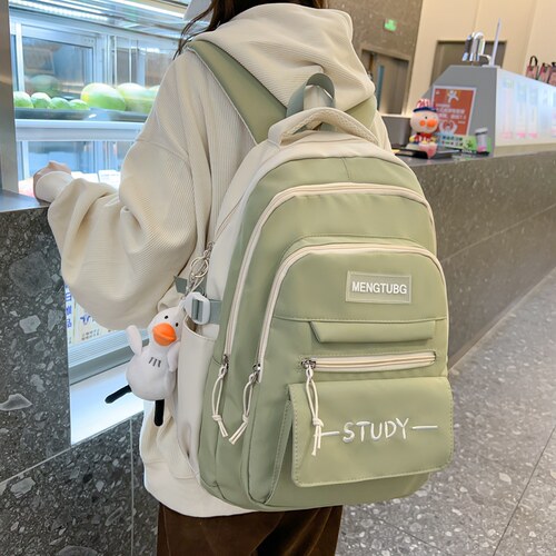 初中高中学生超轻便旅行双肩背包女生小学生三到六年级大容量书包
