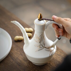 羊脂玉瓷白酒杯陶瓷酒具套装高白瓷高档烈黄酒杯仿古中式家用酒壶