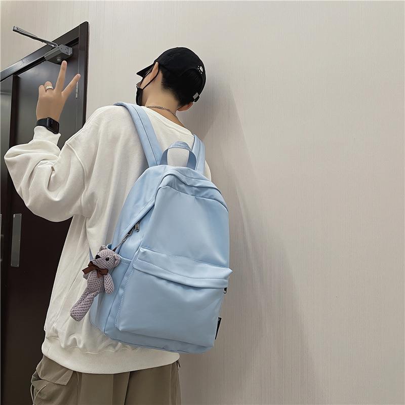 书包女2023韩版情侣新款大容量纯色百搭双肩背潮包小学生初高中生